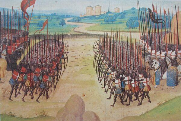 The Battle of Agincourt in 1415 is discussed in "100 Greatest Battles" and depicted in this 15th-century miniature by Enguerrand de Monstrelet. (Public Domain)
