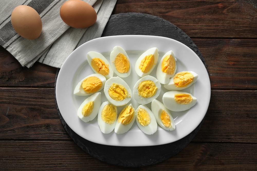 Quartered and grated hard-boiled eggs add a touch of bright yellow to this vibrant salad.(Africa Studio/Shutterstock)