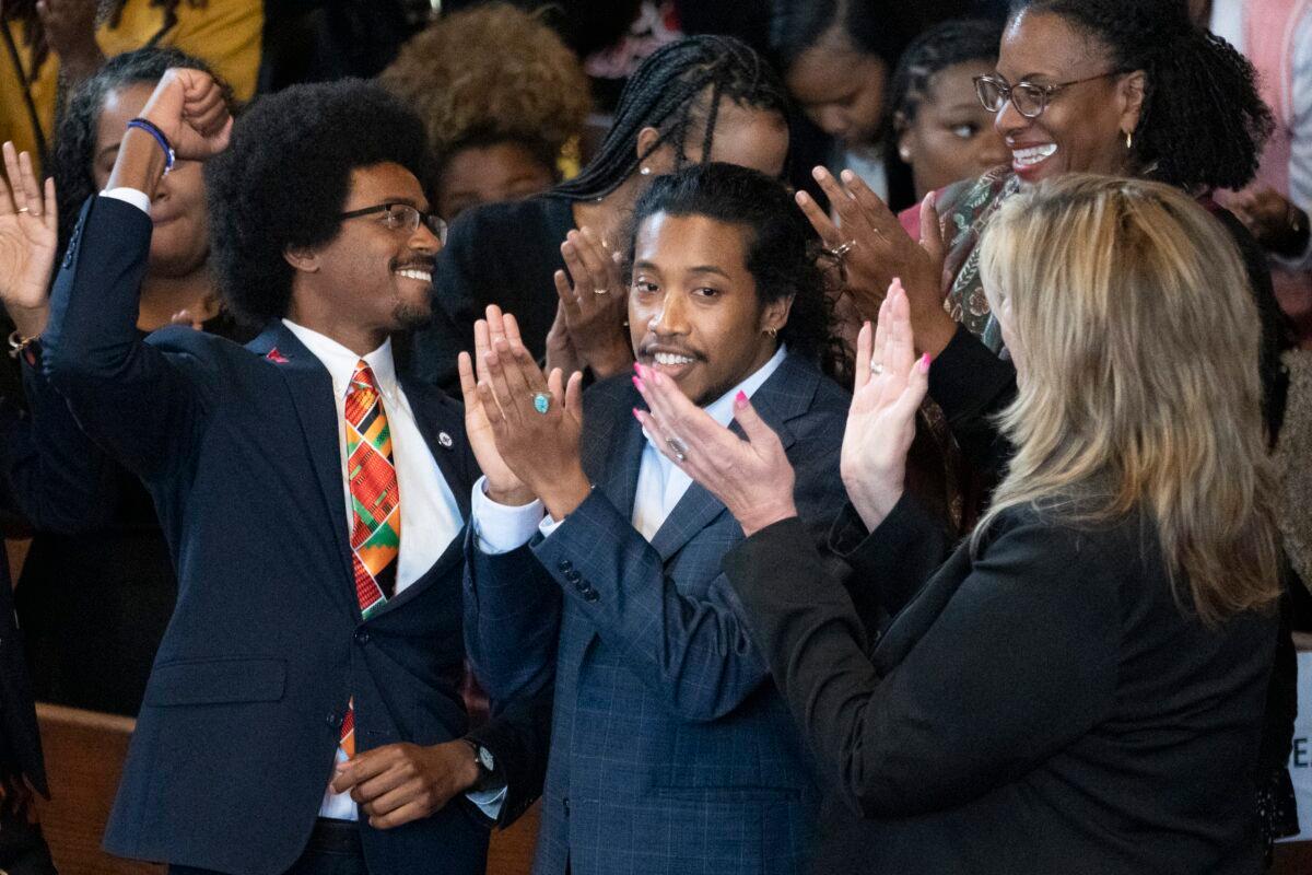 (L–R) Expelled state Rep. Justin Pearson, expelled state Rep. Justin Jones, and Rep. Gloria Johnson are recognized by the audience at Fisk University before Vice President Kamala Harris arrives in Nashville, Tenn., on April 7, 2023. (George Walker IV/AP Photo)