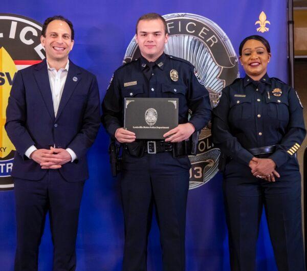Officer Nickolas Wilt (C), was just sworn in as an officer in late March 2023, with Louisville Mayor Craig Greenberg (L) and Louisville Metro Police Department Interim Police Chief Jacquelyn Gwinn-Villaroel (R). (Photo Courtesy of Louisville Metro Police Department)