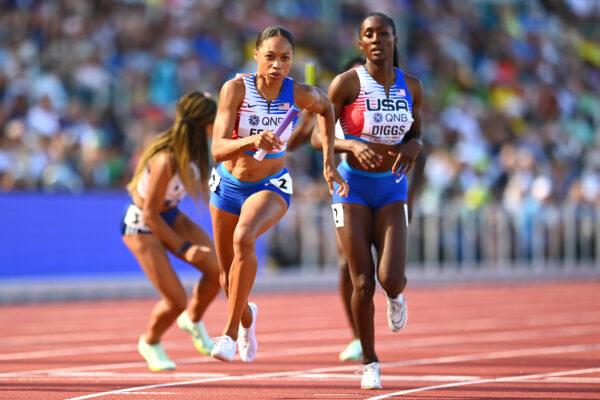 Talitha Diggs of Team United States hands off to Allyson Felix of Team United States in the Women's 4x400m in the World Athletics Championships Oregon22 at Hayward Field in Eugene, Oregon, on July 23, 2022. (Hannah Peters/Getty Images for World Athletics)