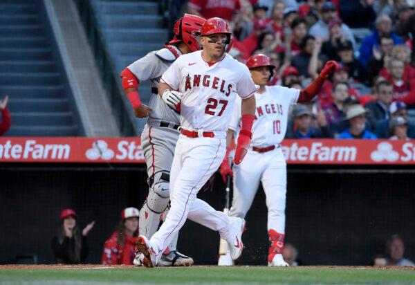 Mike Trout (27) of the Los Angeles Angels scores a run on a two run base hit by Luis Rengifo (2) against starting pitcher Patrick Corbin (46) of the Washington Nationals during the first inning at Angel Stadium of Anaheim in Anaheim, Calif., on April 10, 2023. (Kevork Djansezian/Getty Images)