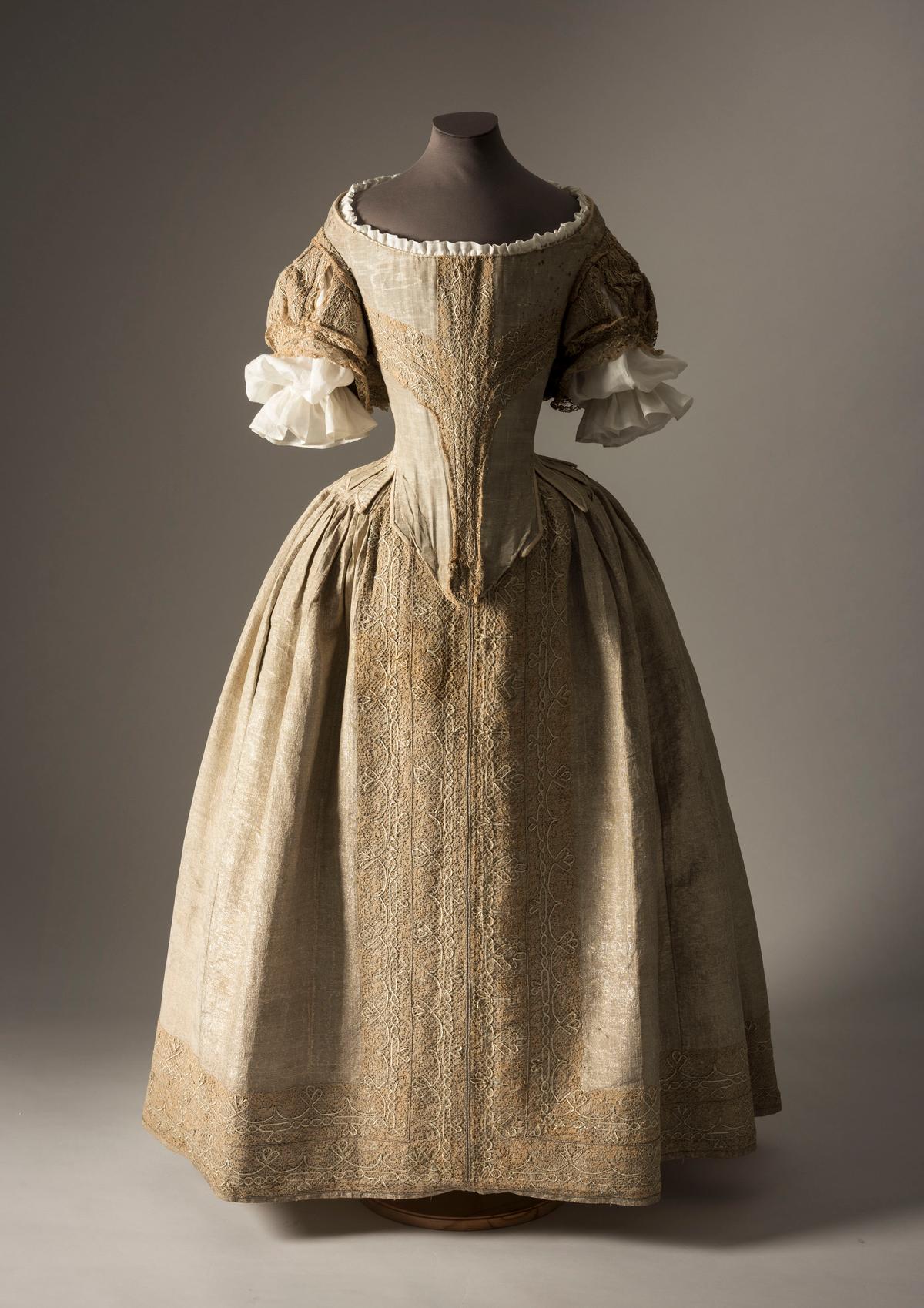 The Silver Tissue Dress, an English court dress from the 1660s, is on display at the Crown to Couture fashion exhibition at London's Kensington Palace from Apr. 5 to Oct. 29, 2023. (Courtesy of Fashion Museum Bath)