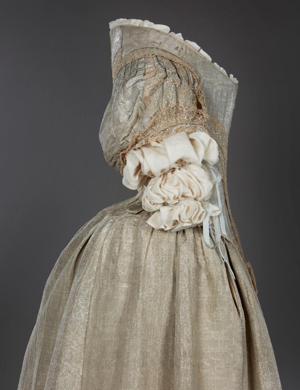The Silver Tissue Dress is comprised of a whalebone bodice and skirt handmade from fine silk woven with real silver thread. (© Historic Royal Palaces / Fashion Museum Bath)