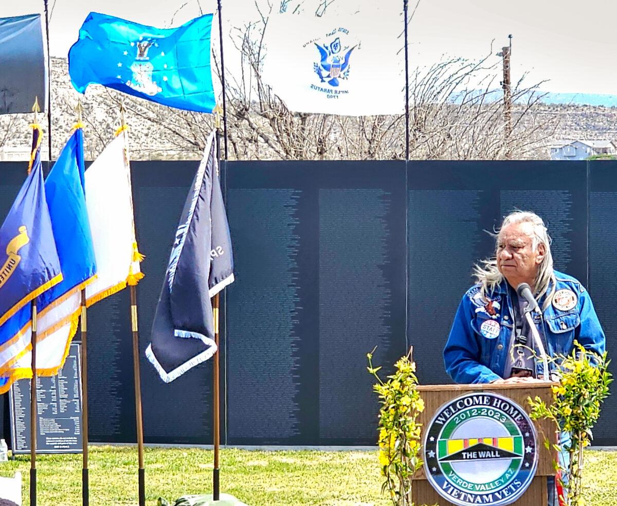 A speaker and Vietnam veteran takes the podium during a ceremony in Camp Verde, Ariz., on March 29, 2023. (Allan Stein/The Epoch Times)