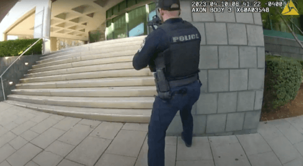 Officer Cory Galloway moves toward an ongoing shooting incident captured by Officer Nickolas Wilt's bodycam at Old National Bank in Louisville, Ky., on April 10, 2023, in this screengrab. (Louisville Metro Police Department/Screenshot via The Epoch Times)