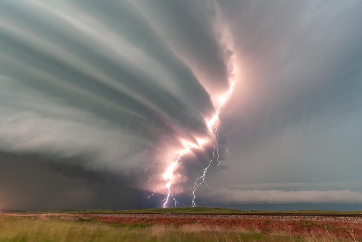 A bolt of lightning strikes through storm cloud "pancakes" in Alliance, Nebraska. (Courtesy of <a href="https://www.facebook.com/5elementsxposure">Gunjan Sinha</a>)