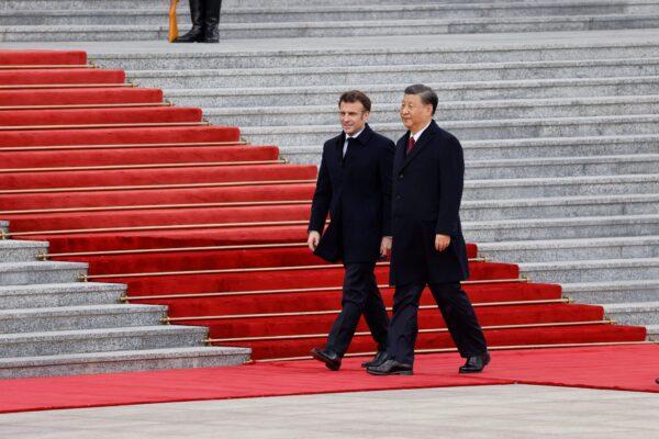 Chinas leader Xi Jinping (L) and French President Emmanuel Macron attend the official welcoming ceremony in Beijing, China, on April 6, 2023. (Ludovic Marin/AFP via Getty Images)