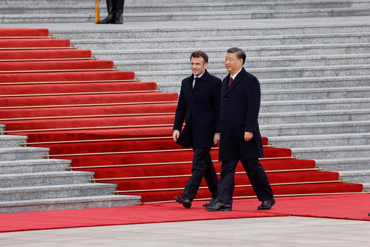 Chinese leader Xi Jinping (L) and French President Emmanuel Macron attend the official welcoming ceremony in Beijing, China, on April 6, 2023. (Ludovic Marin/AFP via Getty Images)