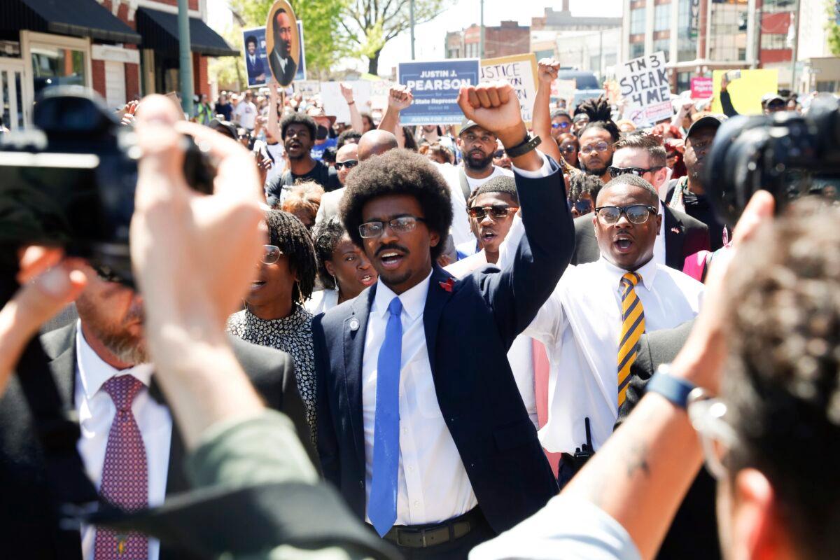 Justin Pearson and his supporters march to the Shelby County Board of Commissioners meeting in Memphis, Tenn., on April 12, 2023. (Chris Day/The Commercial Appeal via AP)