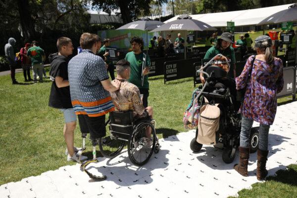 Festival attendees check in using QR codes at Ability Fest in Melbourne, Australia, on Nov. 27, 2021. (Graham Denholm/Getty Images)