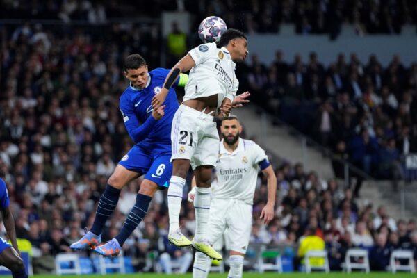 Real Madrid's Rodrygo (R), and Chelsea's Thiago Silva jump for the ball during the Champions League quarterfinal, first leg, soccer match between Real Madrid and Chelsea at the Santiago Bernabeu stadium in Madrid, on April 12, 2023. (Manu Fernandez/AP Photo)