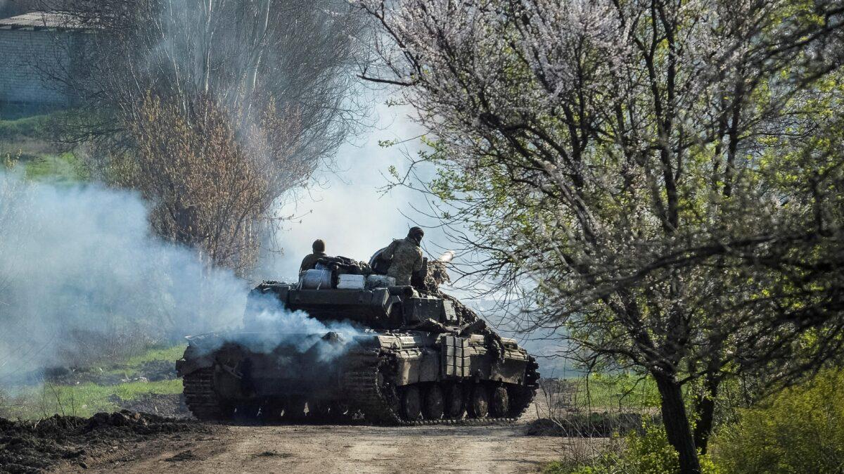 Ukrainian service members ride a tank as Russia's attack on Ukraine continues, near the front line city of Bakhmut, Ukraine, on April 10, 2023. (Oleksandr Klymenko/Reuters)