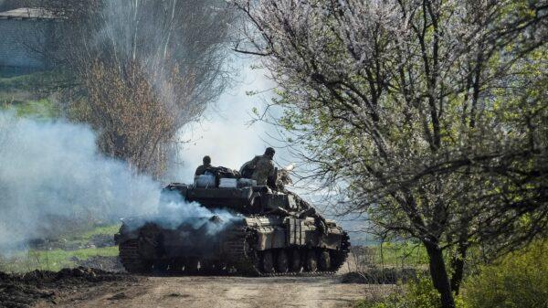 Ukrainian service members ride a tank, as Russia's attack on Ukraine continues, near the front line city of Bakhmut, Ukraine, on April 10, 2023. (Oleksandr Klymenko/Reuters)