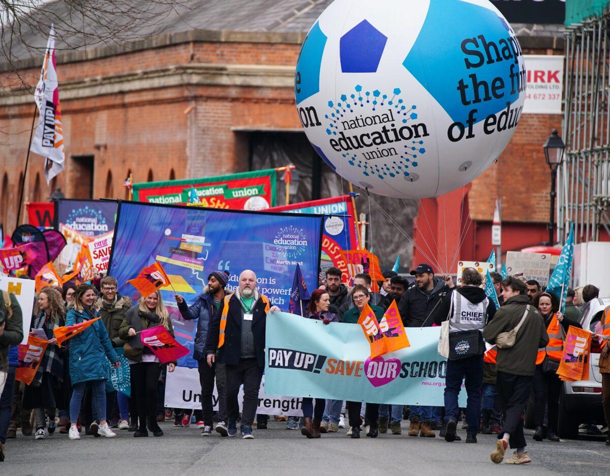 Mary Bousted (C), joint General Secretary of the National Education Union, joins members at a rally in central Manchester, as teachers in the north of England begin the first of three days of nationwide strike action, on Feb. 28, 2023. (Peter Byrne/PA Media)