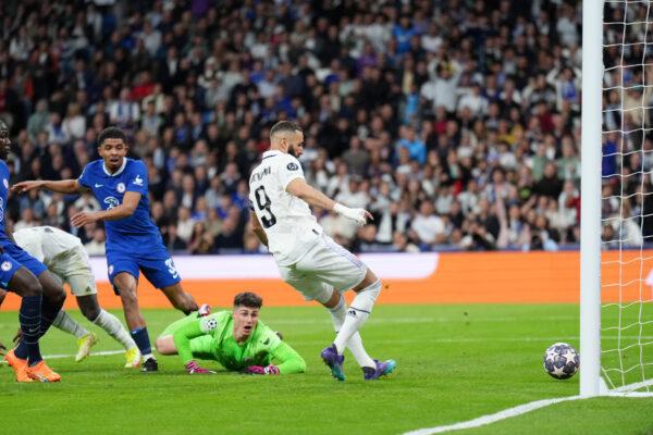 Karim Benzema of Real Madrid scores the team's first goal as Kepa Arrizabalaga of Chelsea looks on during the UEFA Champions League quarterfinal first leg match between Real Madrid and Chelsea FC at Estadio Santiago Bernabeu in Madrid on April 12, 2023. (Angel Martinez/Getty Images)