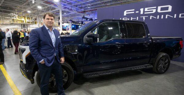 Ford CEO Jim Farley poses for a photo at the introduction of the electric Ford F-150 Lightning pickup truck at the Ford Rouge Electric Vehicle Center in Dearborn, Mich., on April 26, 2022. It costs about $10,000 more than a gas-powered F-150. (Bill Pugliano/Getty Images)