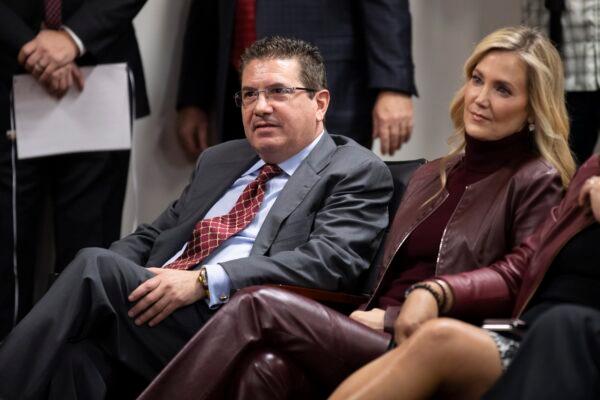 Washington Redskins owner Dan Snyder (L) and his wife Tanya Snyder listen to head coach Ron Rivera during a news conference at the team's NFL football training facility in Ashburn, Va., on Jan. 2, 2020. (Alex Brandon/AP Photo)