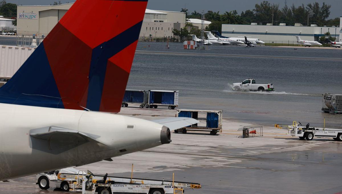 Planes sit at their gates after the Fort Lauderdale-Hollywood International Airport was closed due to the runways being flooded in Fort Lauderdale, Fla., on April 13, 2023. (Joe Raedle/Getty Images)