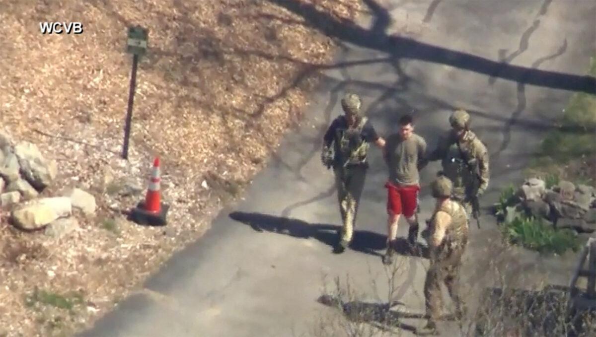 FBI agents arrest Jack Teixeira, an employee of the U.S. Air Force National Guard, in connection with an investigation into the leaks online of classified U.S. documents, in North Dighton, Massachusetts, on April 13, 2023. (WCVB-TV via ABC via Reuters)