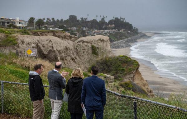 Officials view the Amtrack coastal railway line in San Clemente, Calif. on April 13, 2023. (John Fredricks/The Epoch Times)
