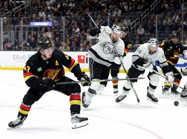 Quinn Hughes of the Vancouver Canucks skates against the Los Angeles Kings in Los Angeles on April 10, 2023. (Harry How/Getty Images)