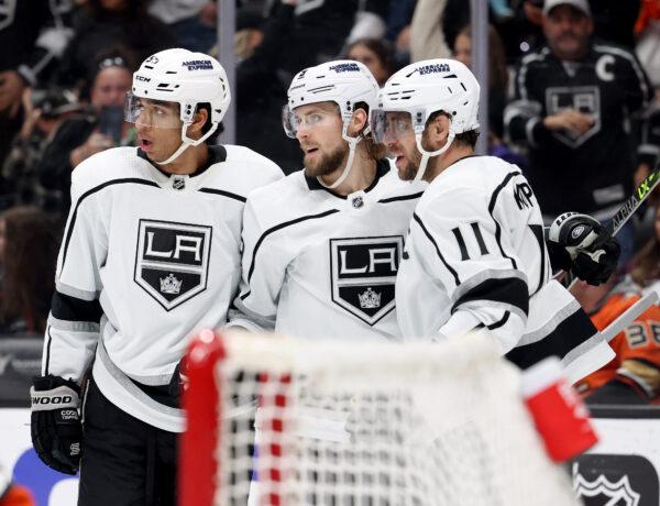 Anze Kopitar (11) of the Los Angeles Kings celebrates his goal with Adrian Kempe (9 and Quinton Byfield (55), to tie the game 1–1 with the Anaheim Ducks, during the first period at Honda Center in Anaheim, Calif., on April 13, 2023. (Harry How/Getty Images)