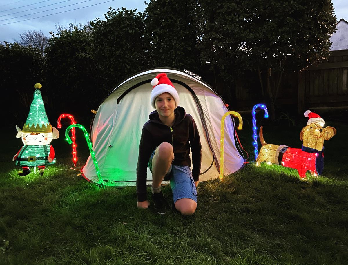 Max Woosey and his tent, decorated for the holidays. (Courtesy of Rachel Woosey)