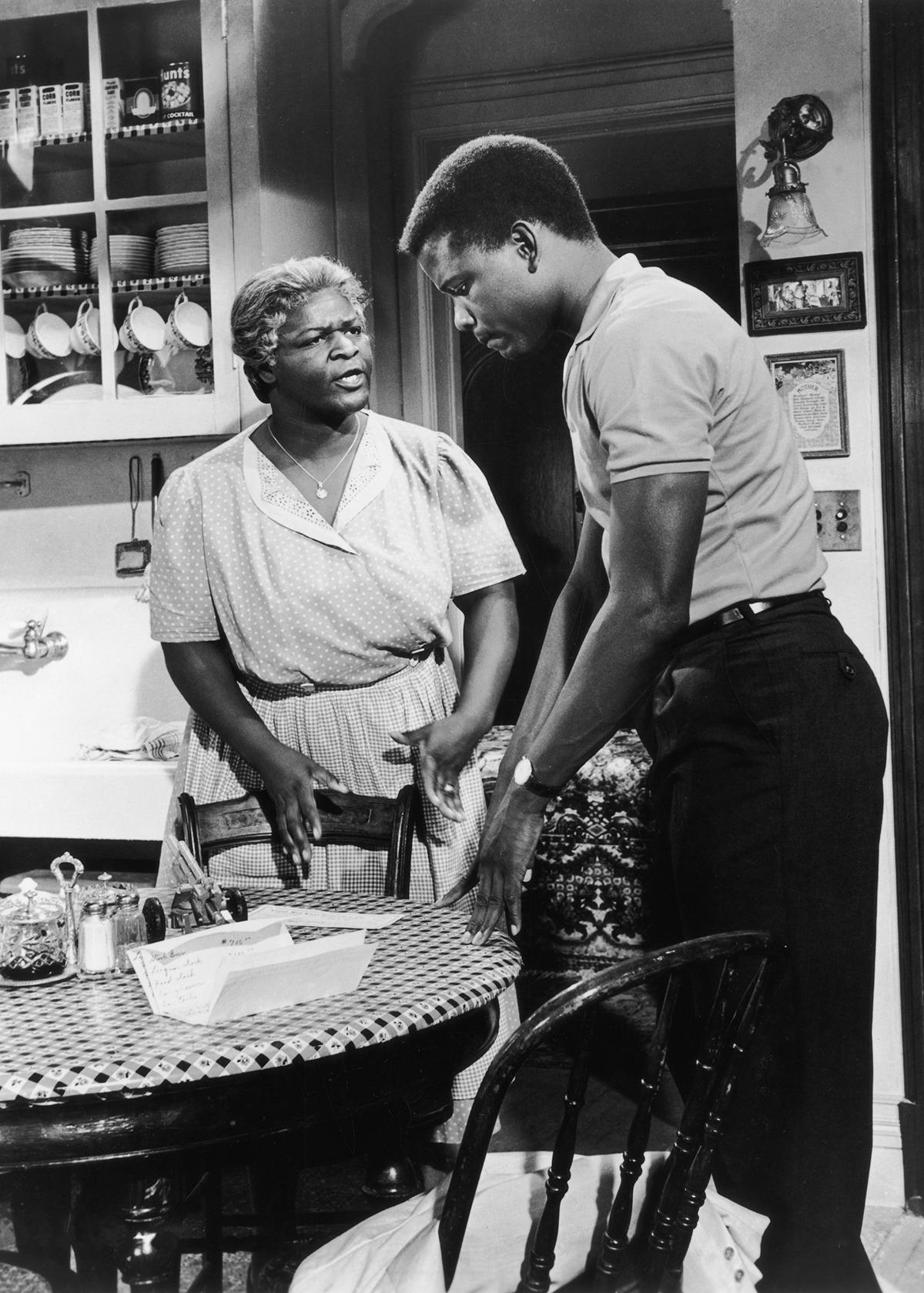 (L–R) Lena (Claudia McNeil) talks with her son, Walter Lee (Sidney Poitier), in the film version of "A Raisin in the Sun." (MovieStillsDB)