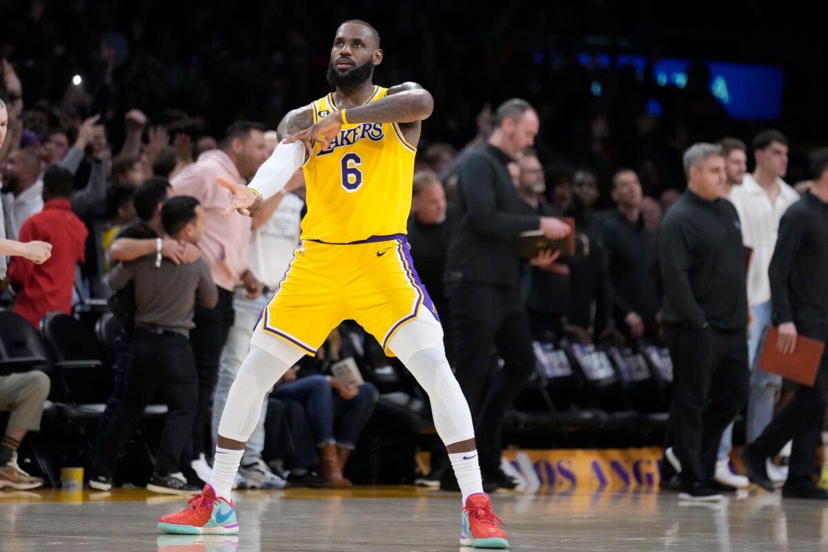 Los Angeles Lakers forward LeBron James (6) celebrates after a 3-point basket by Dennis Schroder in the closing second of regulation in the team's NBA basketball play-in tournament game against the Minnesota Timberwolves in Los Angeles on April 11, 2023. (Marcio Jose Sanchez/AP Photo)