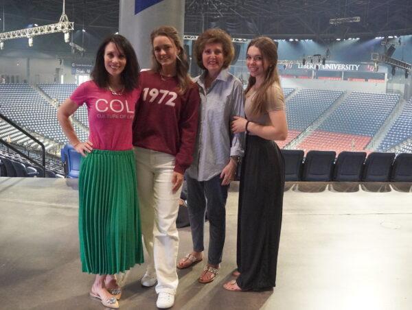 (L to R) Carla Nicole, co-founder and chief designer of Culture of Life 1972, a fashion company that supports pro-life charities, Savannah Dudzik of Live Action, a pro-life non-profit organization, Carla's mother Maria Shoemaker, and Carla's daughter Giulia Nicole, a rising freshman attending Liberty University at Liberty University's Vine Center, after Florida Gov. Ron DeSantis' speech in Lynchburg, Va., on Apr. 14, 2023. (Terri Wu/The Epoch Times)