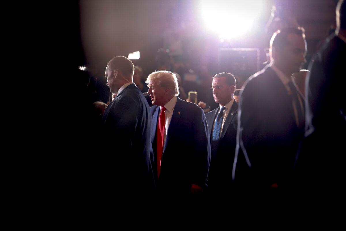 Former U.S. President Donald Trump greets supporters as he arrives at an event at Mar-a-Lago in West Palm Beach, Florida, on April 4, 2023. (Joe Raedle/Getty Images)