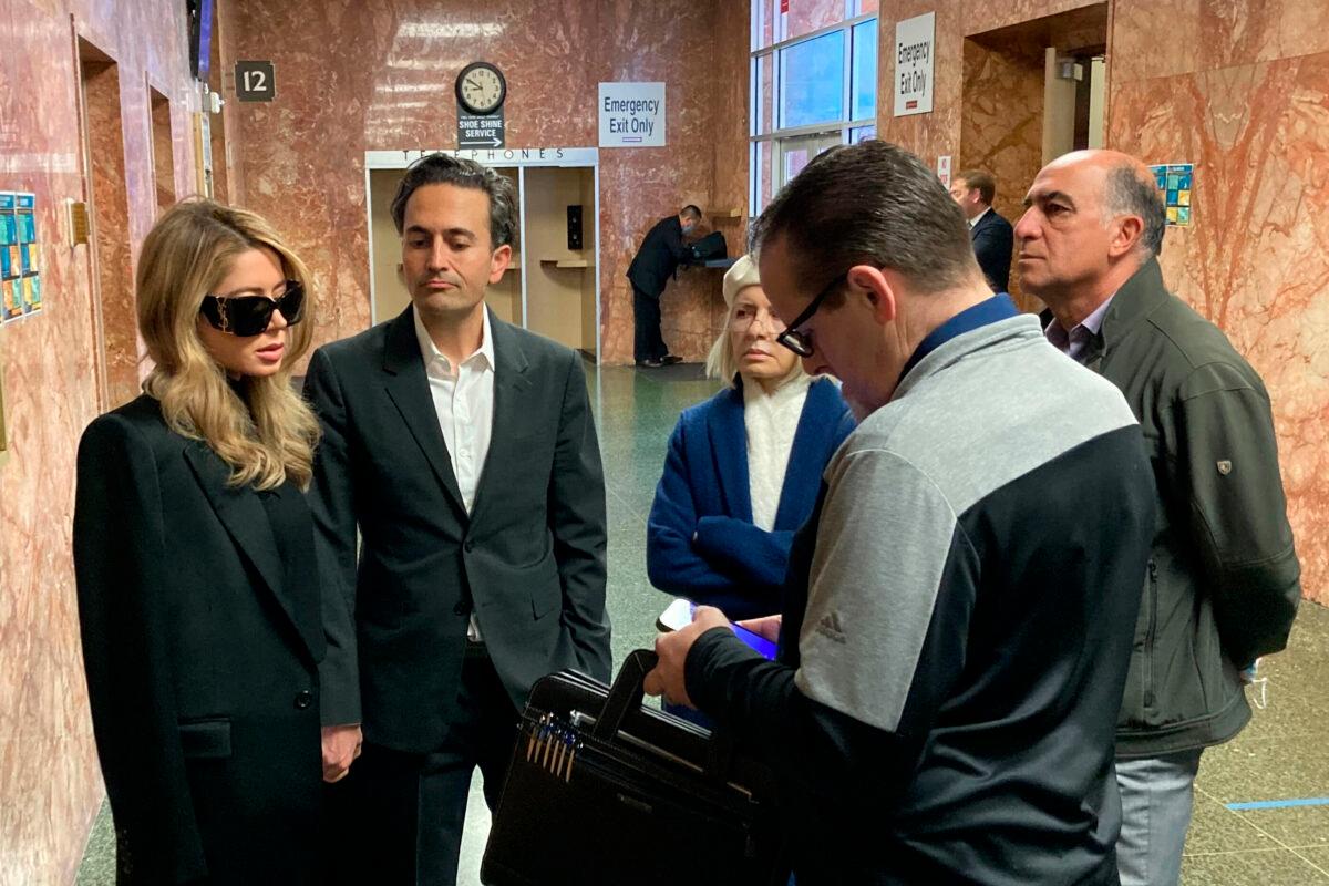 Khazar Elyassnia (L) stands in the Hall of Justice in San Francisco on April 14, 2023, ahead of an appearance by her brother, Nima Momeni, who has been charged with murder in the death of tech entrepreneur Bob Lee. (Olga Rodriguez/AP Photo)