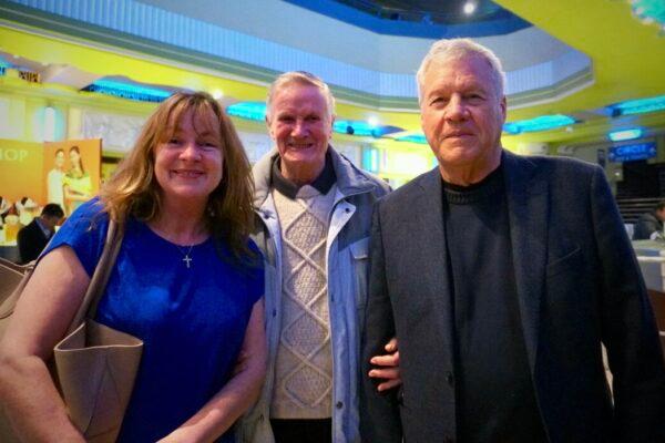 (L–R) Jane MacDonald-Styslinger, her father, and her husband, Bill Styslinger, attended Shen Yun Performing Arts at the Eventim Apollo, in London, on April 14, 2023. (Mary Mann/The Epoch Times)