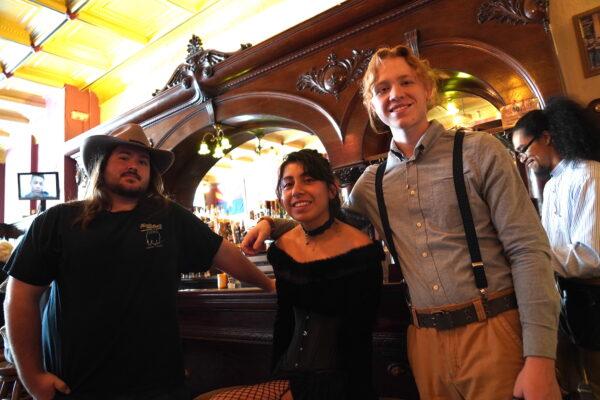 Palace Bar general manager Raymond Moreno (L) and employees wear Old West-themed clothing at the Palace Bar in Prescott, Ariz., on April 13, 2023. (Allan Stein/The Epoch Times)