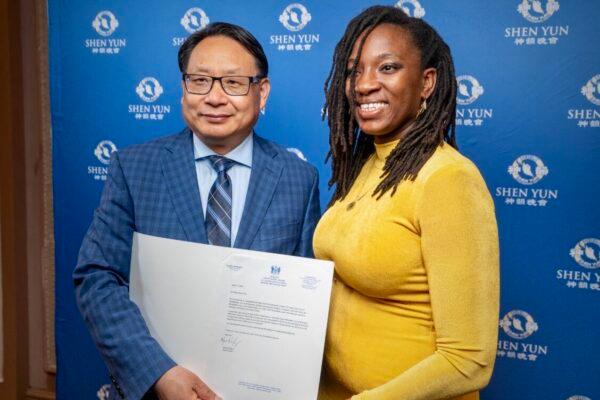 Sen. Pinkney (R), at the end of the Shen Yun performance on April 13, 2023, presents a congratulatory certificate to Shen Yun Performing Arts, accepted by a representative from the Greater Philadelphia Falun Dafa Association. (Serena Shi/The Epoch Times)