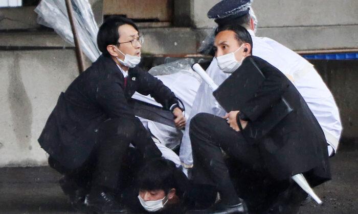 Japan’s PM Evacuated Unharmed After ‘Smoke Bomb’ Thrown at Speech Site