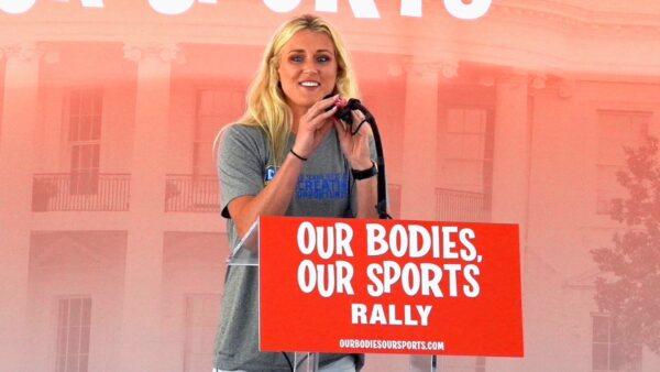 Riley Gaines, a former University of Kentucky swimmer who tied for fifth place against transgender swimmer Lia Thomas at the NCAA Championships in March, speaks at the “Our Bodies, Our Sports” rally at Freedom Plaza in Washington on June 23, 2022. (Terri Wu/The Epoch Times)