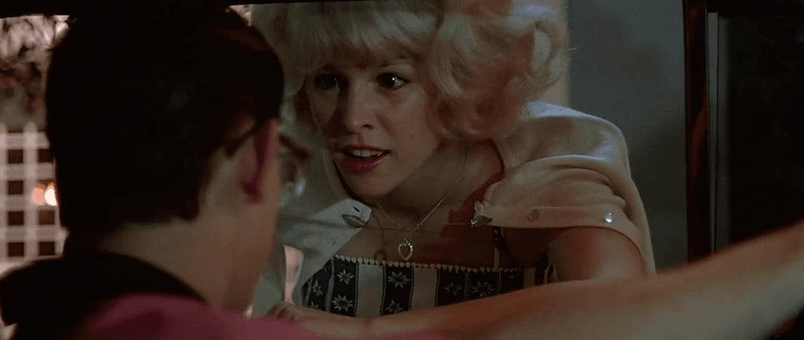 "I love the feel of tuck and roll upholstery," says Debbie Dunham (Candy Clark) to the cruising Toad (Charles Martin Smith), in “American Graffiti.” (Lucasfilm Ltd./The Coppola Company/Universal Pictures)