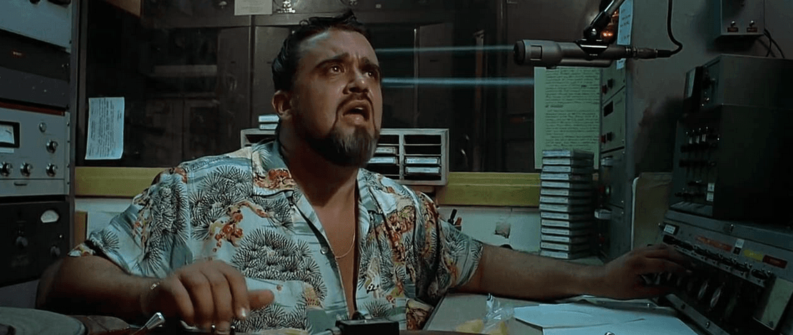 He who is apparently not disc jockey Wolfman Jack (Wolfman Jack), using a little echo/reverb to demonstrate that "the Wolfman is everywhere-where-wherrrre..." but is not, in fact, him, in “American Graffiti.” (Lucasfilm Ltd./The Coppola Company/Universal Pictures)