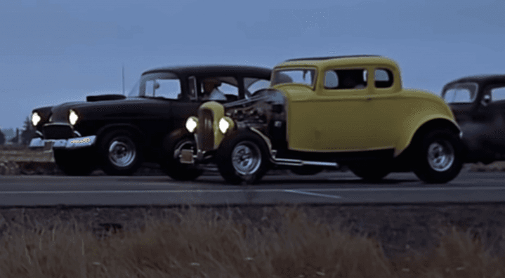 Falfa's '55 Chevrolet One-Fifty (L) versus Milner's '32 Ford 5-Window Coupe  getting ready to burn rubber, in “American Graffiti.” (Lucasfilm Ltd./The Coppola Company/Universal Pictures)