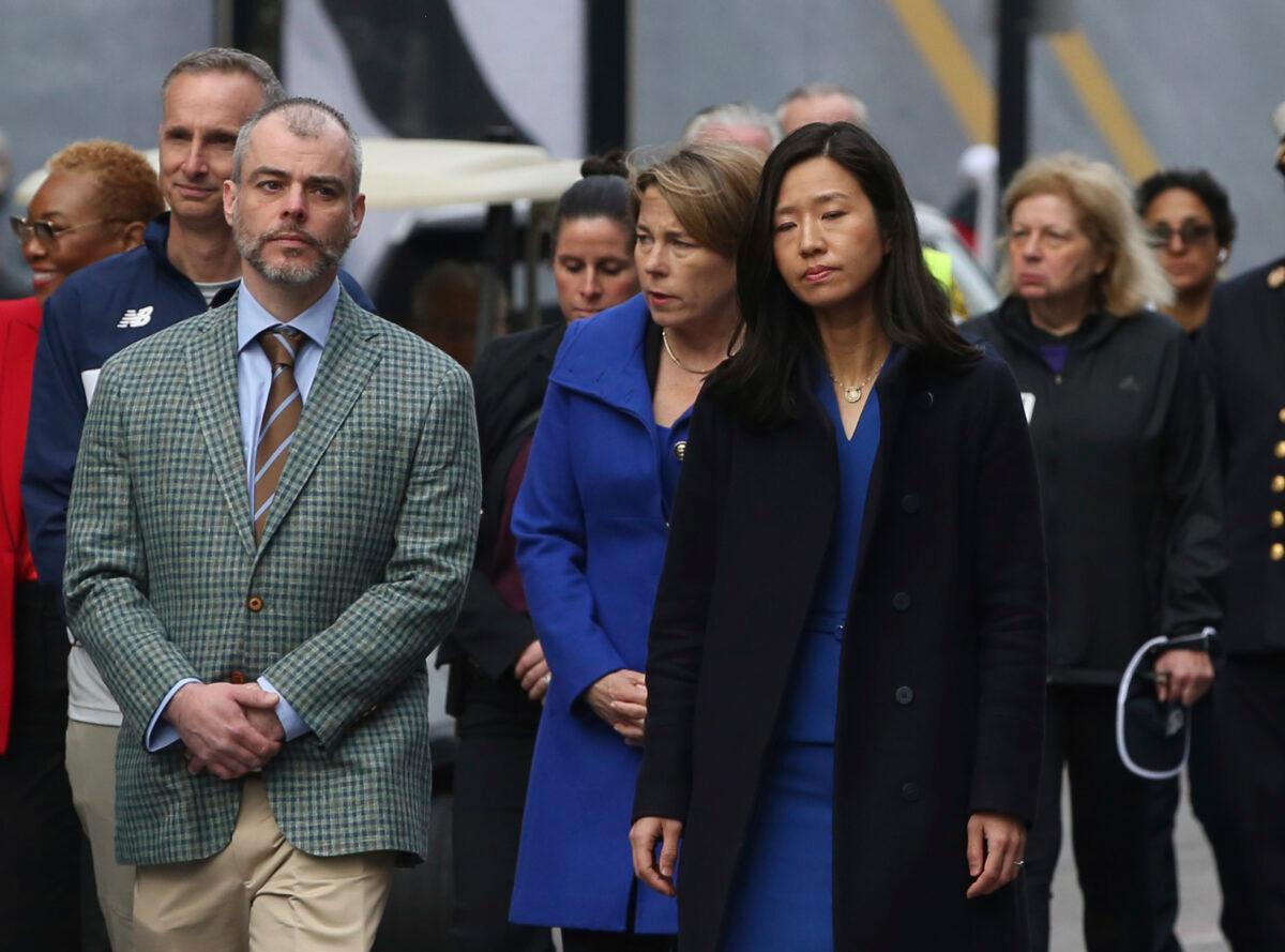 Boston Mayor Michelle Wu (R) walks with Massachusetts Governor Maura Healey (C) and Bill Campbell, father of bombing victim Krystle Campbell, during a gathering near memorials for victims of the 2013 Boston Marathon bombing, in Boston on April 15, 2023. (Reba Saldanha/AP Photo)