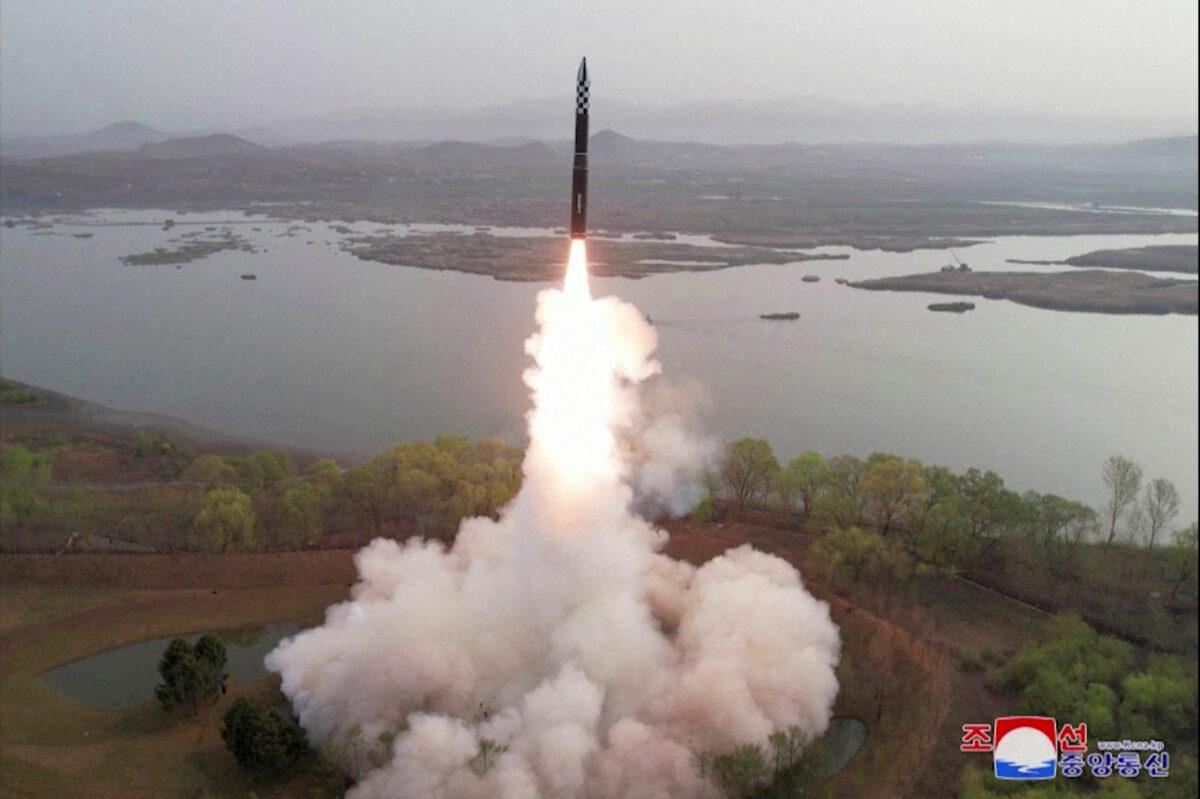 A test launch of a new solid-fuel intercontinental ballistic missile (ICBM), Hwasong-18, at an undisclosed location in this still image of a photo used in a video released by North Korea's Korean Central News Agency (KCNA) on April 14, 2023. (KCNA via Reuters TV)