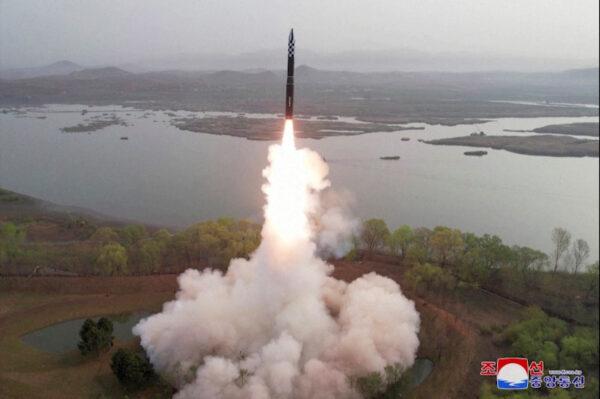 A test launch of a new solid-fuel intercontinental ballistic missile (ICBM) Hwasong-18 at an undisclosed location in this still image of a photo used in a video released by North Korea's Korean Central News Agency (KCNA) on April 14, 2023. (KCNA via Reuters TV)