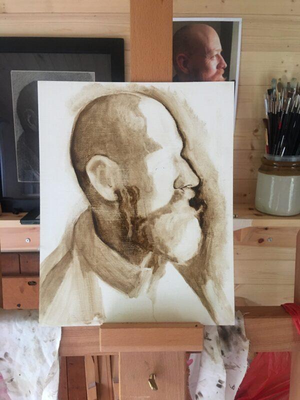 Artist Paula Wilson paints in the classical tradition, laboriously building her work up layer by layer. Pictured on her easel here is an underpainting of her brother. (Courtesy of Paula Wilson)