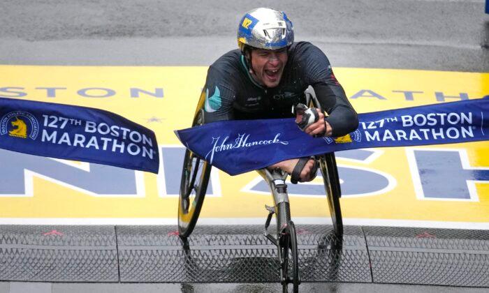 Hug, Scaroni Take Boston Marathon Wheelchair Titles