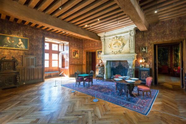 The stately apartments are richly decorated in the Neo-Renaissance style, a 19th-century architectural revival of the Renaissance period. Here, the Biencourt salon illustrates the taste of the château’s past owners. The large fireplace is the centerpiece of this room, along with the wooden paneling. The walls are covered in leather-patterned wallpaper and portraits from the Renaissance, acquired by the Biencourt family in the spirit of authenticity. Overall, the luxurious yet comfortable atmosphere was faithfully reproduced, with original furniture from Mobilier National. (Viacheslav Lopatin/Shutterstock)