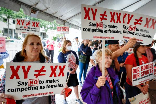 Demonstrators listen to the speaking program during an "Our Bodies, Our Sports" rally for the 50th anniversary of Title IX at Freedom Plaza in Washington, on June 23, 2022. (Anna Moneymaker/Getty Images)