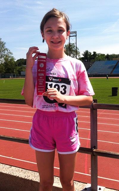 Selina Soule shows off a ribbon from a track event in Connecticut when she was 10. (Courtesy of Selina Soule)