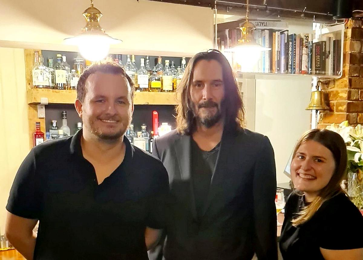 Danny Ricks and Laura James said they "managed to keep it together" while serving Keanu Reeves. (SWNS)